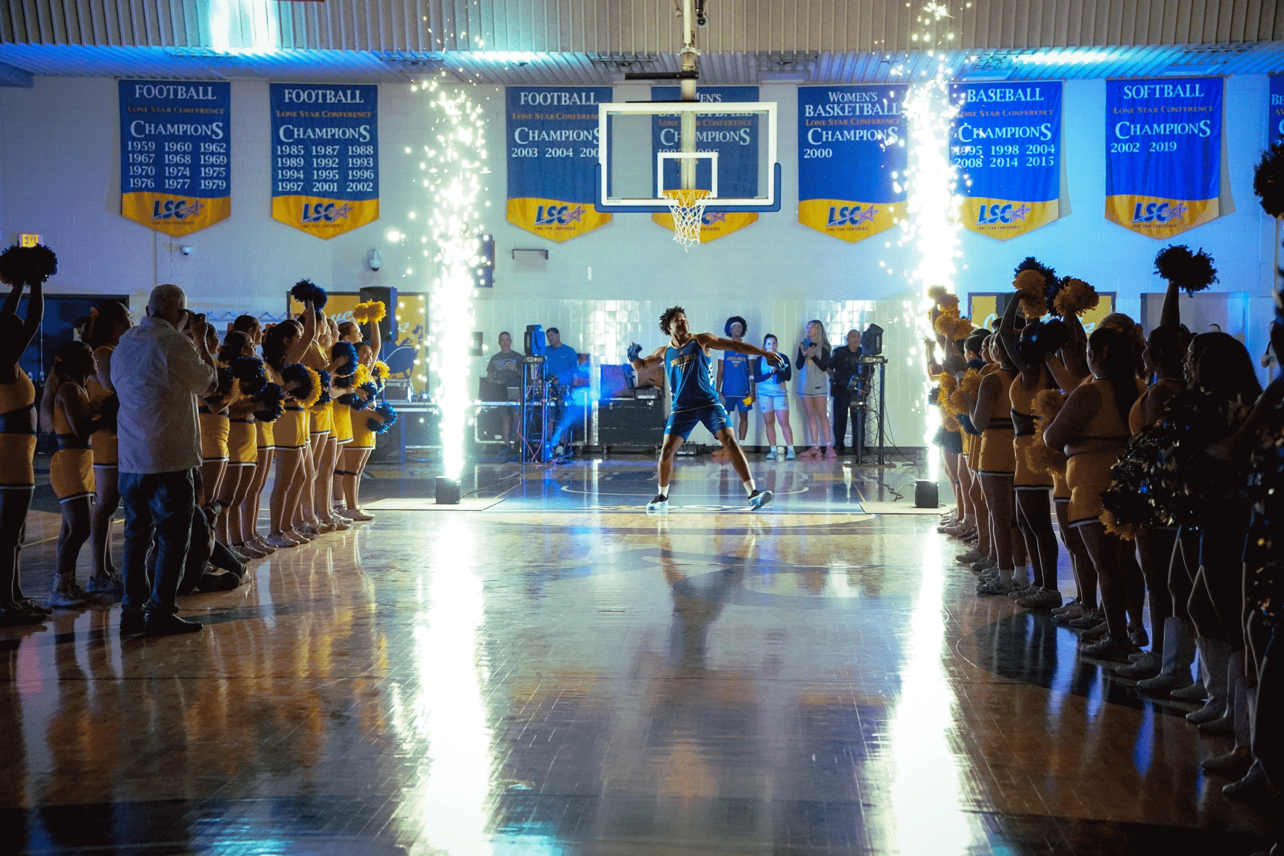 Photo by: Edward Green Sophomore basketball player, David Oriaku throws a javelina t-shirt to pump up the crowd during Homecoming week at the Javelina Madness event.